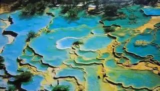 Discover Huanglong and its limestone pools in China