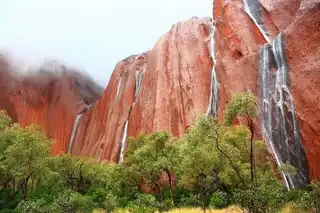 The rare stunt show on Uluru when it rains