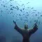 The statue under the water of the Christ of the Abyss of San Fruttuoso in Italy